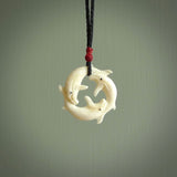 Hand carved natural bone whale trilogy pendant. Art to wear. Ocean themed pendants.