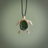 New Zealand Jade stone turtle in Sterling silver engraved casing. Hand carved jewellery made by NZ Pacific and for sale online. Moana, Ocean, jewellery hand carved in fire agate and Sterling Silver turtle necklace.