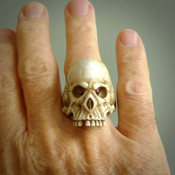 Hand carved bone skull ring. Made from Red Deer antler in New Zealand. Unique  skull ring hand made from deer antler by master bone carver Fumio Noguchi. Spectacular collectable work of art, made to wear. One only ring, delivered to you at no extra cost with express courier.