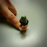 This is a handcrafted New Zealand Marsden jade stack ring with sterling silver. The colours are a deep and light green. This is a solid little work of art. We ship this worldwide for free and are happy to answer any questions that you may have about these or other products on our website.