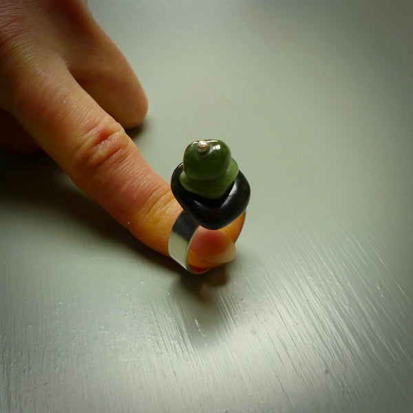 This is a handcrafted New Zealand Marsden jade stack ring with sterling silver. The colours are a deep and light green. This is a solid little work of art. We ship this worldwide for free and are happy to answer any questions that you may have about these or other products on our website.