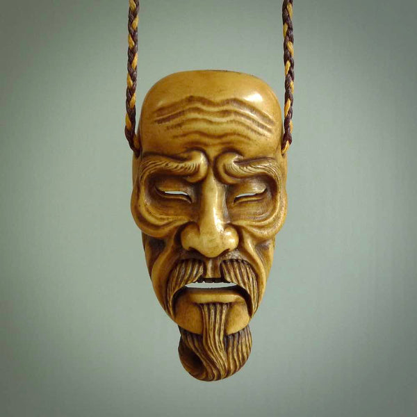 A spectacular piece of wearable art for all lovers of traditional play masks, Japanese culture and just very fine carving! KAGEKIYO is a magnificent carving, hand crafted from Deer antler and stained with a dye that Fumio makes specifically for this purpose.