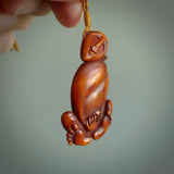 Hand carved stained bone meditating male figure pendant. Made from natural bone. Bone jewellery from the Pacific for sale online. Male pendant for men and women.