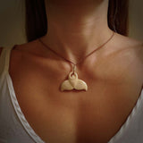 Hand carved whale tail pendant. Carved from woolly mammoth tusk in 10,000 year old mammoth tusk. A rare and original handmade pendant for ocean lovers.