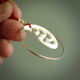 Hand carved pendants made from bone with sterling silver. NZ Pacific contemporary Koru pendants for sale online.