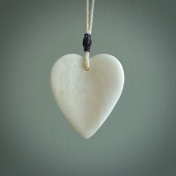 HAND CARVED HEART PENDANT. CARVED FROM BONE. PAUA HEART INSERT. HAND MADE BY NZ PACIFIC. HANDMADE JEWELLERY FOR SALE ONLINE.