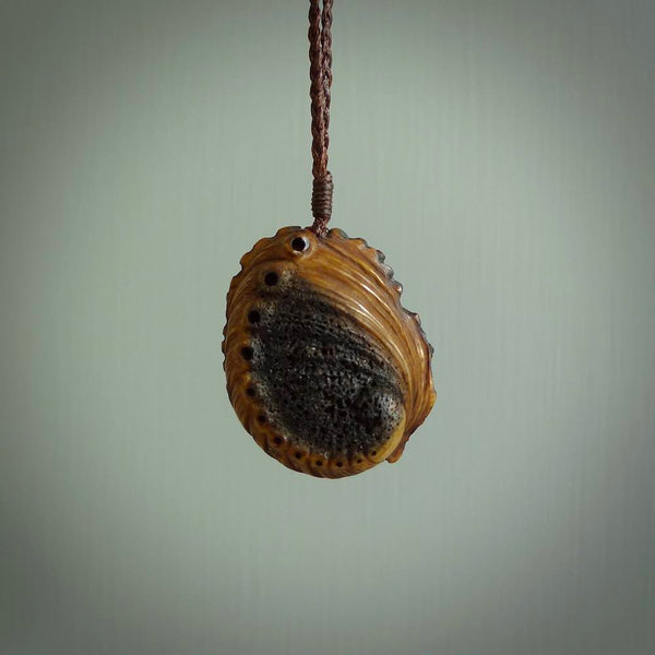 Hand carved deer antler Paua Shell Pendant. Made from Red Deer antler in New Zealand. Unique Pāua Shell necklace hand made from deer antler by master bone carver Fumio Noguchi. Spectacular collectable work of art, made to wear. One only pendant, delivered to you at no extra cost with express courier.