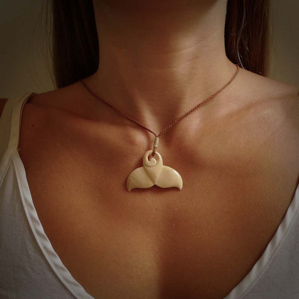 Hand carved whale tail pendant. Carved from woolly mammoth tusk in 10,000 year old mammoth tusk. A rare and original handmade pendant for ocean lovers.