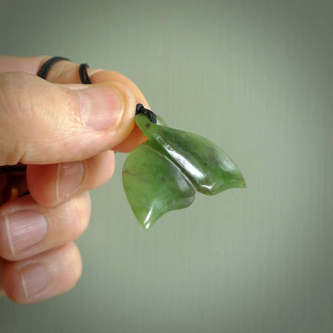Hand carved New Zealand Jade whale tail pendant. Carved for NZ Pacific. Handmade ocean themed jewellery for sale online.