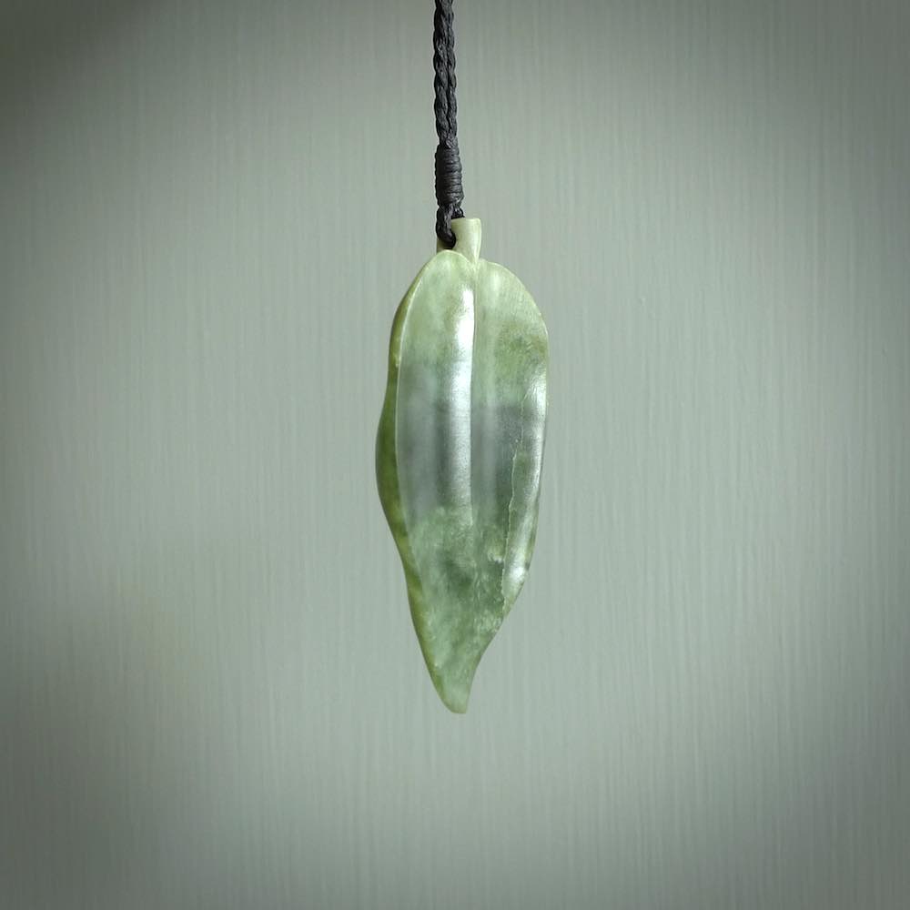 Hand carved New Zealand Jade leaf pendant with adjustable cord. This piece is a stand out work of creativity and skill and we love Raegan Bregmen's creations. Unique, one only, New Zealand made necklace for sale. Free shipping worldwide.