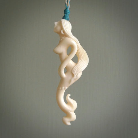 This pendant is a gorgeous and intricately carved mermaid and merman pendant. Carved by renowned bone carver Yuri Terenyi for us, this is a little masterpiece. The craftsmanship displayed in this piece is extraordinary - a collectors item, or a piece to wear and love.
