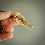 This is a hand carved deer antler huia bird skull pendant. It is made from deer antler, bone. This is a large sized necklace and is a very unique, one only, pendant that is a collectors piece. Hand carved deer antler huia skull necklace for men and women.