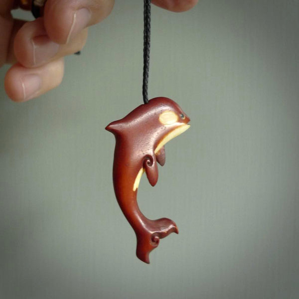 Stained Bone and natural bone orca. Hand carved pendant made by NZ Pacific. Hand carved Bone orca necklace hand made by Yuri Terenyi.
