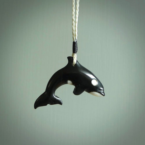 Hand carved black jade Orca pendant. Ocean themed pendants hand carved from natural materials by NZ Pacific. Unique handmade jewellery.