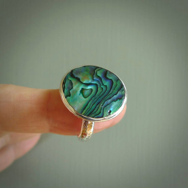 Hand made Paua Shell ring with sterling silver. Paua Shell ring with sterling silver hand made here in New Zealand. Shipping is included in the price.