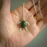 New Zealand Jade stone turtle in Sterling silver engraved casing. Hand carved jewellery made by NZ Pacific and for sale online. Moana, Ocean, jewellery hand carved in fire agate and Sterling Silver turtle necklace.