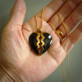 This is a handcarved love heart pendant made from a gorgeous and striking piece of Black Jade with gold plated silver. This is a superbly carved and very unique piece if custom jewellery. For sale online from NZ Pacific.