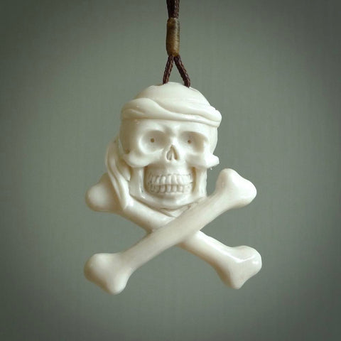 Hand carved natural bone pirate skull pendants online for sale. Creative pirate skull necklaces hand made from bone. Free shipping worldwide. We provide this pendant with an adjustable cord.