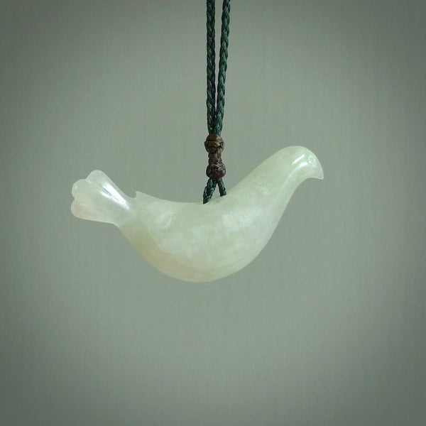 This pendant is a hand carved contemporary dove bird pendant. Carved in jadeite stone. It is a finely shaped piece with gentle and soft lines and is a great representation of the peace that doves traditionally represent. We ship these worldwide with DHL express courier. A fantastic and meaningful gift.