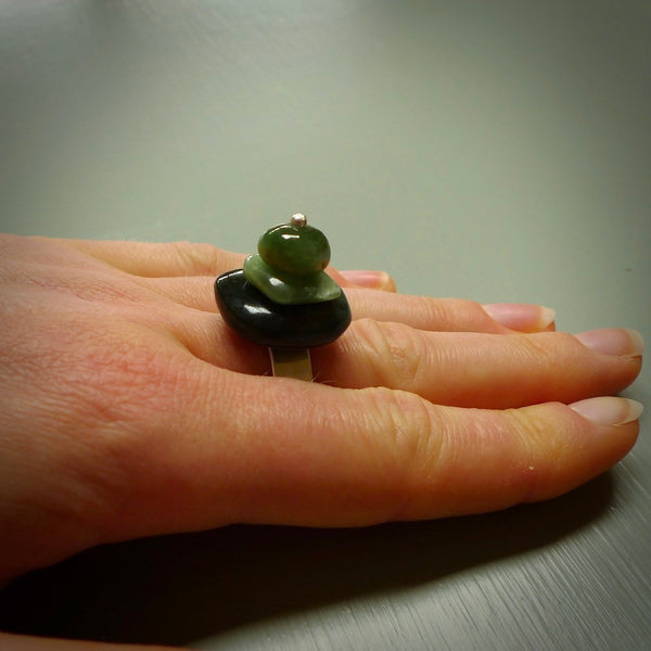 This is a handcrafted New Zealand Marsden jade stack ring with sterling silver. The colours are a deep and light green. This is a solid little work of art. We ship this worldwide for free and are happy to answer any questions that you may have about these or other products on our website.