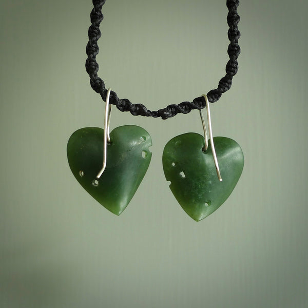These are stunning heart shaped jade kawakawa leaf earrings carved in New Zealand by Josey Coyle. It is carved from a deep green piece of New Zealand Jade and with Sterling Silver hooks.