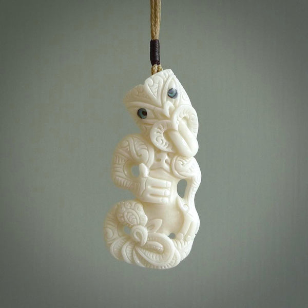 Hand carved tiki. Tiki Pendant made from cow bone by NZ Pacific. Ethnic handcarved jewellery for sale online.
