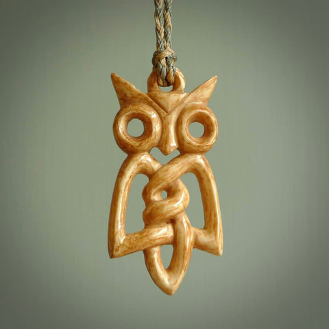 A traditional Celtic Owl design carving, hand made for us from bone. This is a work of art and is a collectable piece of traditional bone carving. It can be worn as a special piece of jewellery or displayed. This is art made to wear at its finest.