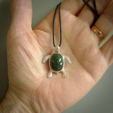 New Zealand Jade stone turtle in Sterling silver engraved casing. Hand carved jewellery made by NZ Pacific and for sale online. Moana, Ocean, jewellery hand carved in fire agate and Sterling Silver turtle necklace.