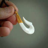 Hand carved white onyx pendant. Hook, matau pendant hand made in New Zealand. NZ Pacific jewellery for sale online.