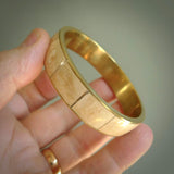 This piece is a hand made bracelet. It is made from selected pieces of woolly mammoth tusk which we have cut and polished and then inset into a brass bracelet. It is a very striking piece one of a kind and truly beautiful.
