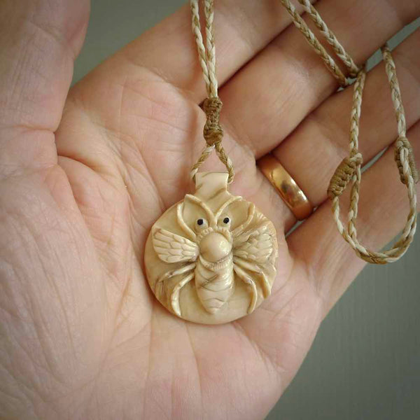 This is a handcarved pendant depicting a beetle on the front face. it is carved from Woolly Mammoth tusk and is a beautiful creamy, golden colour. A lovely and unique necklace for those of us who are fascinated with beetles.