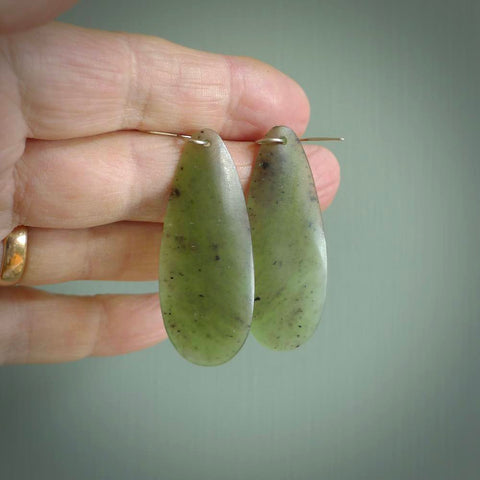 These are stunning large drop shaped jade earrings carved in New Zealand by Darren Hill. It is carved from a semi-translucent light green piece of New Zealand Jade and with Sterling Silver hooks.