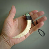 Boars Tusk Pendant with a jade cap. Hand made pendant carved from a boars tusk. Hand made ethnic or maori jewellery for sale by NZ Pacific online.