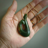 This matau is carved from a very striking New Zealand jade. It is both intricate and simple in design - it has hidden folds and smooth curves. A piece to be worn or displayed - the carving and the jade are both magnificent. One only jade hook necklace hand made by Ric Moor.