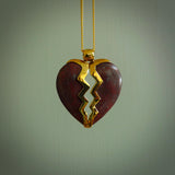 This is a handcarved love heart pendant made from a gorgeous and striking piece of red jasper stone with gold plated silver. This is a superbly carved and very unique piece if custom jewellery. For sale online from NZ Pacific.