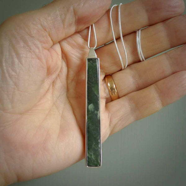 Hand carved New Zealand jade drop pendants with Sterling Silver. Contemporary drop necklaces that are hand made and will make fashionable statements around your neck. These beautiful Jade drops are in a sterling silver encasing. For sale by NZ Pacific and shipped free worldwide.