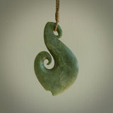 This koru, is carved from a very striking New Zealand jade. It is both intricate and simple in design - it has hidden folds and smooth curves. A piece to be worn or displayed - the carving and the jade are both magnificent.