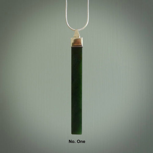 Hand carved New Zealand jade drop pendant with a sterling silver cap and chain.