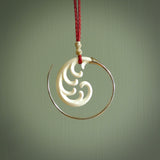 Hand carved pendants made from bone with sterling silver. NZ Pacific contemporary Koru pendants for sale online.