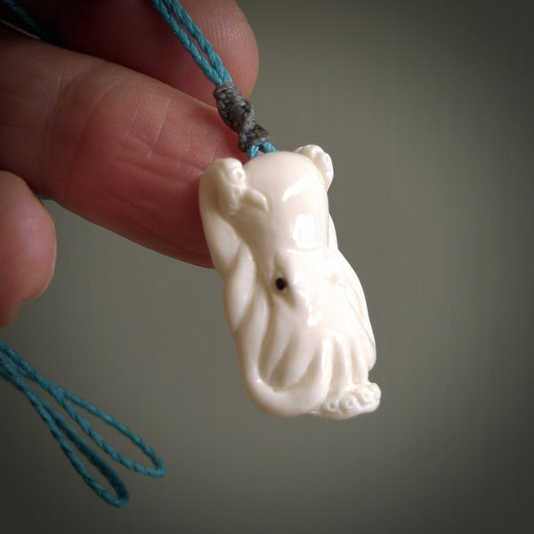 This is a beautiful little hand carved octopus pendant. It is a very cute little pendant that we have carved in natural, untreated bone. We provide these in two cord colours, Black, Pale Honey and Paradise Blue and we shipping is included worldwide so there are no hidden costs when you reach checkout. Hand carved jewellery by NZ Pacific for sale online.