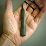 A hand carved large New Zealand Jade drop, roimata, necklace. The cord is a black colour and is a fixed length. A large sized hand made drop necklace by New Zealand artist Kerry Thompson. One off work of art to wear.