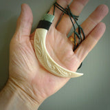 Boars Tusk Pendant with a jade cap. Hand made pendant carved from a boars tusk. Hand made ethnic or maori jewellery for sale by NZ Pacific online.