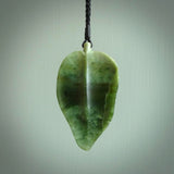 Hand carved New Zealand Jade leaf pendant with adjustable cord. This piece is a stand out work of creativity and skill and we love Raegan Bregmen's creations. Unique, one only, New Zealand made necklace for sale. Free shipping worldwide.