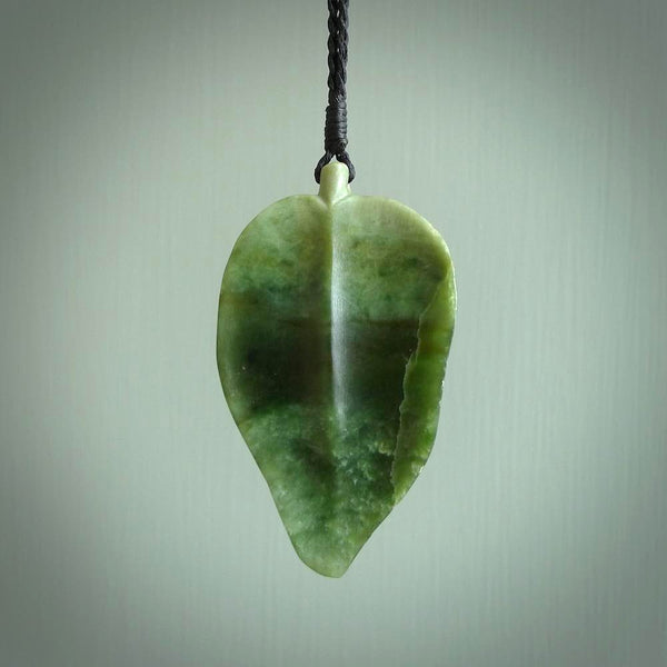 Hand carved New Zealand Jade leaf pendant with adjustable cord. This piece is a stand out work of creativity and skill and we love Raegan Bregmen's creations. Unique, one only, New Zealand made necklace for sale. Free shipping worldwide.