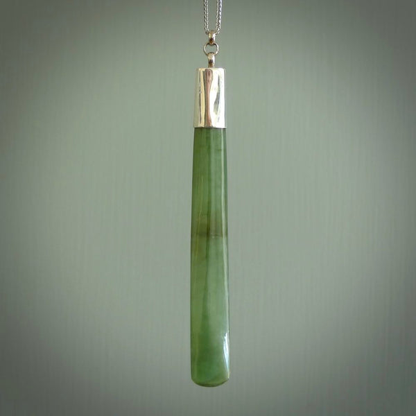 This picture shows two beautiful large sized drop pendants carved in New Zealand Jade, pounamu with sterling silver cap. It is a lovely semi-translucent green colour, which is glows when held to the light. A gorgeous and very meaningful pendant with an sterling silver chain.
