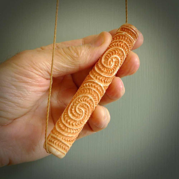A traditional hand carved Māori flute. This piece is made from bone and is a fully functioning musical instrument and can be played. Beautiful ethnic art hand made by NZ Pacific.