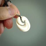 Hand carved koru style pendant. Made from Woolly Mammoth Tusk.