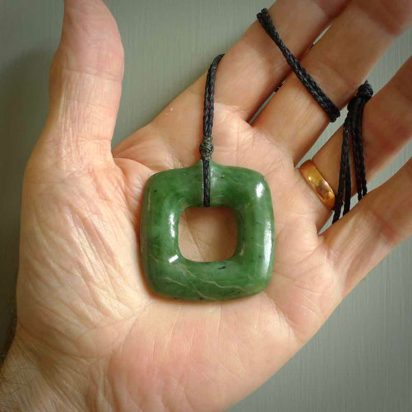 Hand carved jade pendant. Carved by NZ Pacific from New Zealand jade. This is a modern, contemporary pendant made from natural materials.