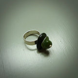 This is a handcrafted New Zealand Marsden jade stack ring with sterling silver. The colours are a deep and light green. This is a solid little work of art. We ship this worldwide for free and are happy to answer any questions that you may have about these or other products on our website.