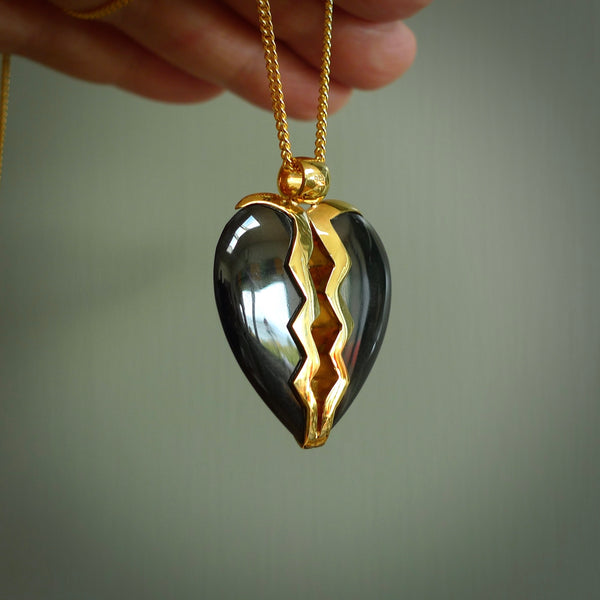 This is a handcarved love heart pendant made from a gorgeous and striking piece of Black Jade with gold plated silver. This is a superbly carved and very unique piece if custom jewellery. For sale online from NZ Pacific.